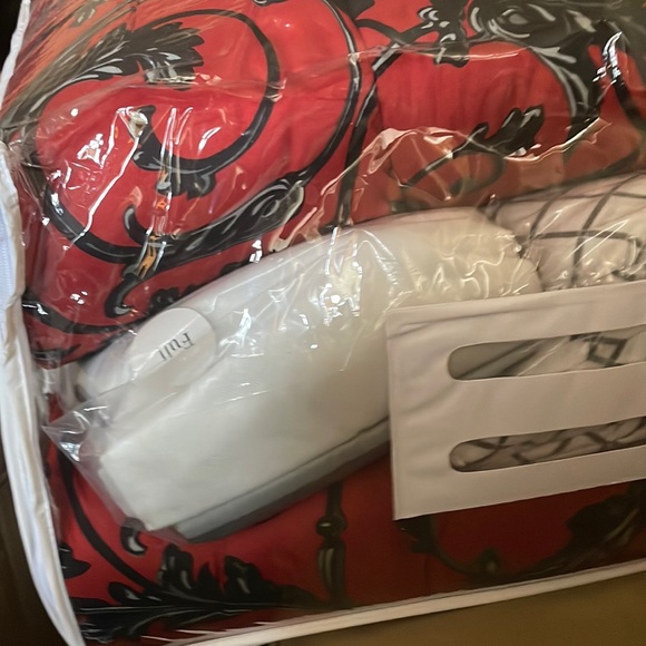 Brand new full size sheet sets, 4 pillows, curtains, and one comforter. All new - Picture 1 of 9